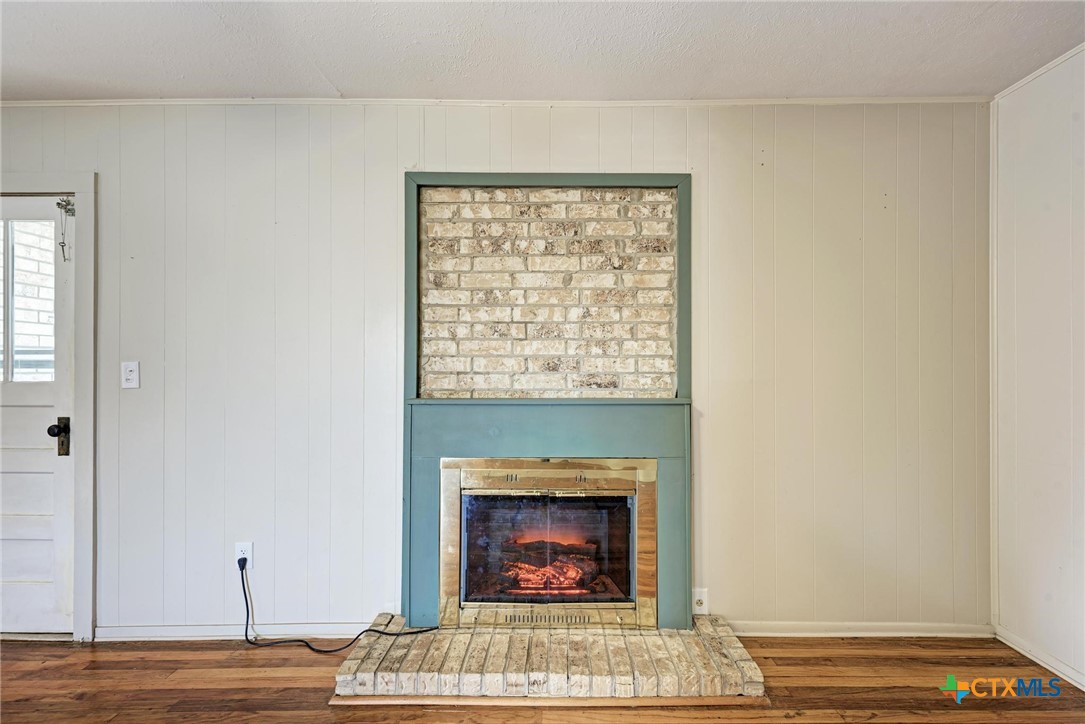 501 North Ridge Street Lampasas, TX 76550 - Photo 14 of 46 a living room with furniture and a fireplace