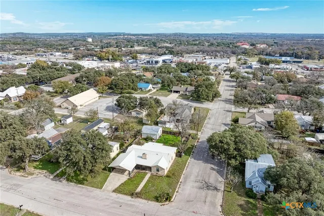 an aerial view of a house with a outdoor space