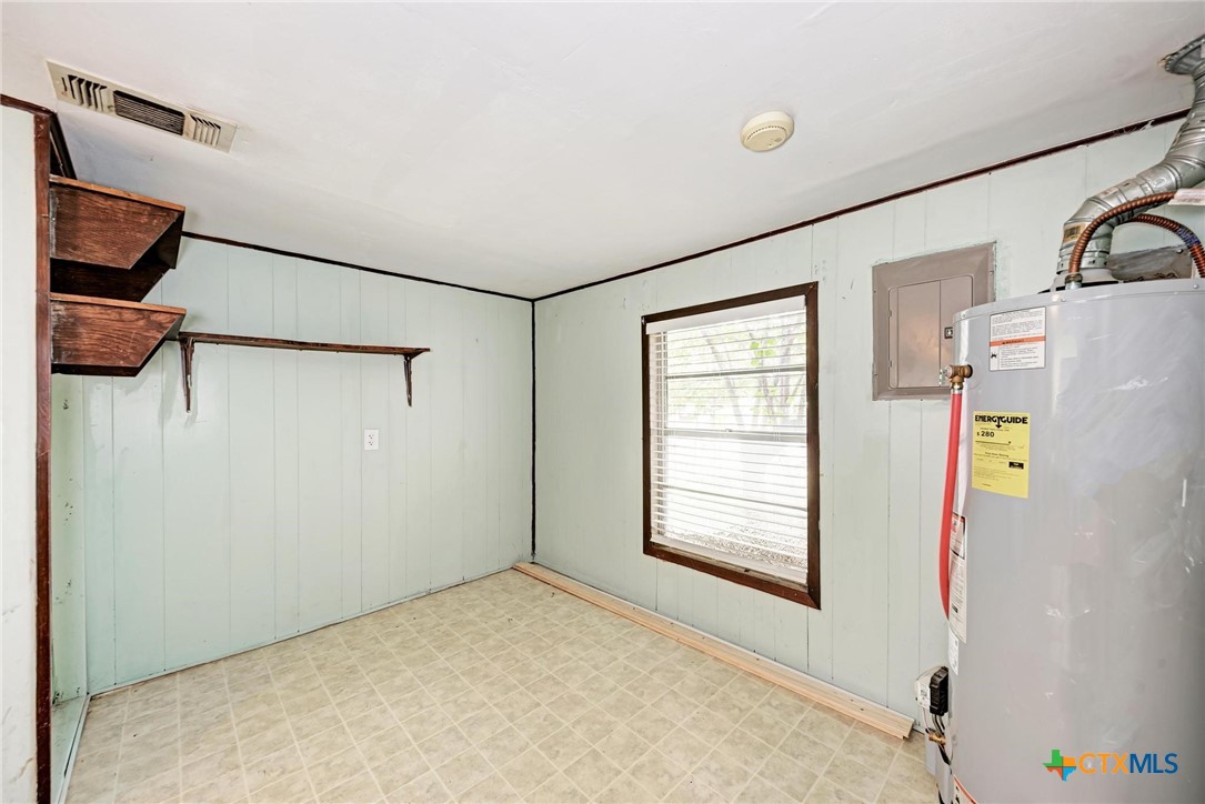 501 North Ridge Street Lampasas, TX 76550 - Photo 36 of 46 a view of empty room with windows and refrigerator