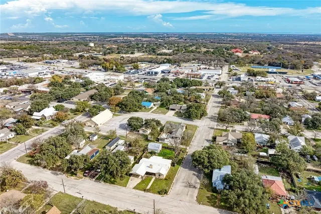 an aerial view of residential building with parking space
