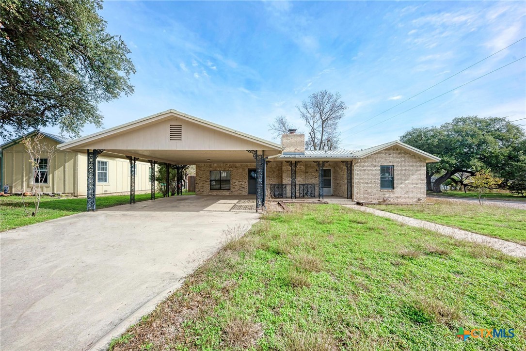 501 North Ridge Street Lampasas, TX 76550 - Photo 5 of 46 a front view of a house with a yard and porch