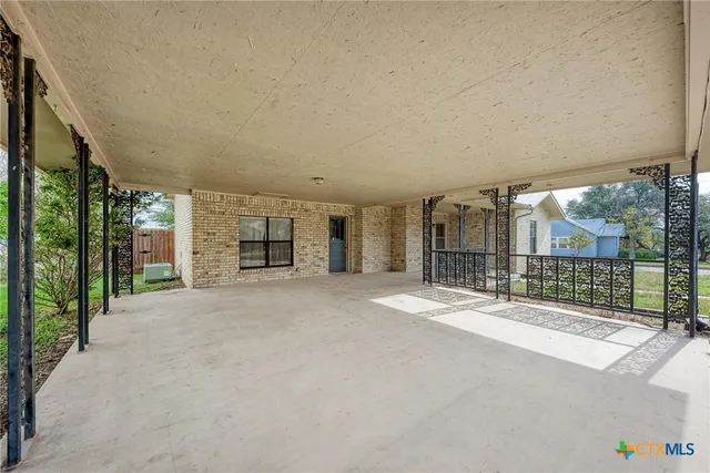 a big room with an outdoor view and seating space