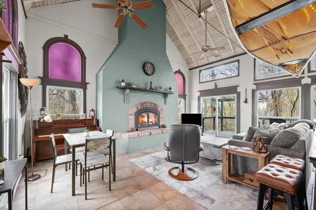 a view of dinning table and chairs in the balcony