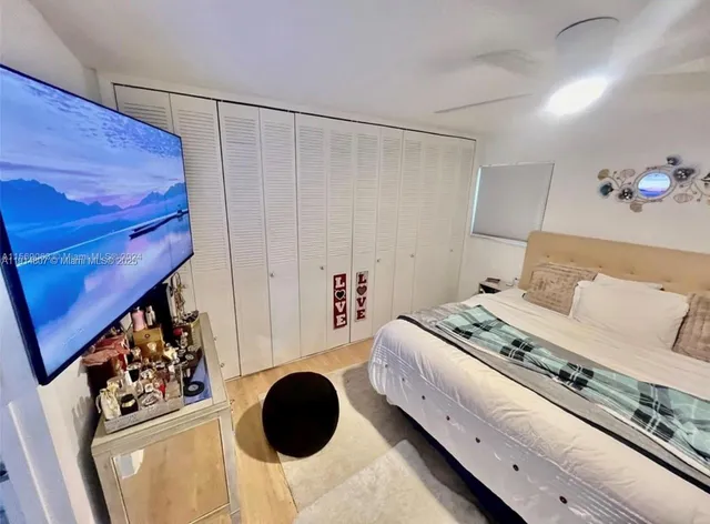 a bedroom with a bed and a cabinets