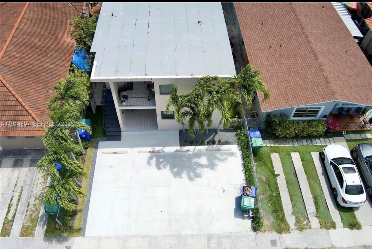 3520 Southwest 25th Street, Unit 3520 Miami, FL 33133 - Photo 4 of 18 a view of swimming pool with outdoor seating and plants