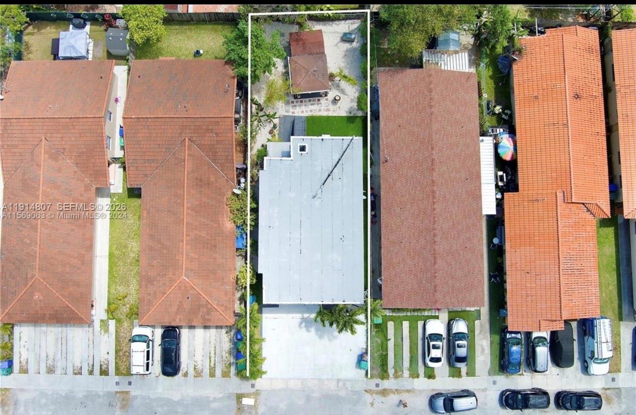 3520 Southwest 25th Street, Unit 3520 Miami, FL 33133 - Photo 6 of 18 an aerial view of residential houses with outdoor space