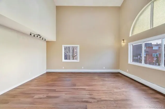 a view of an entryway with wooden floor