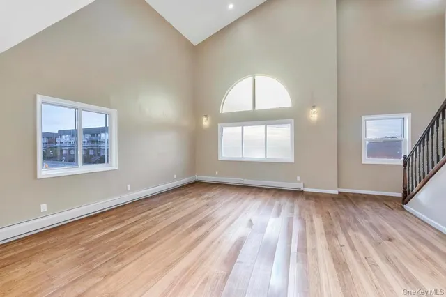 a view of kitchen with furniture and wooden floor
