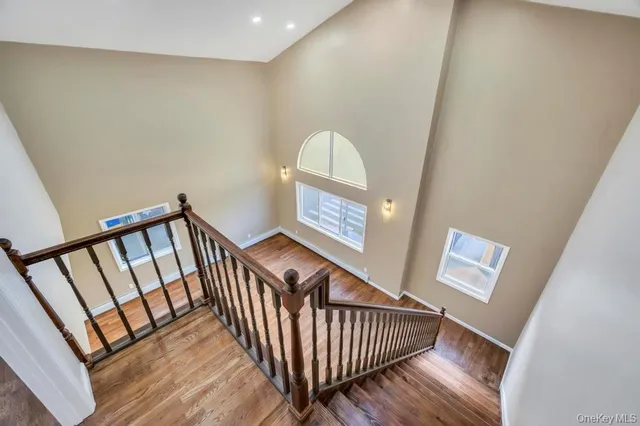 a view of an empty room and wooden floor