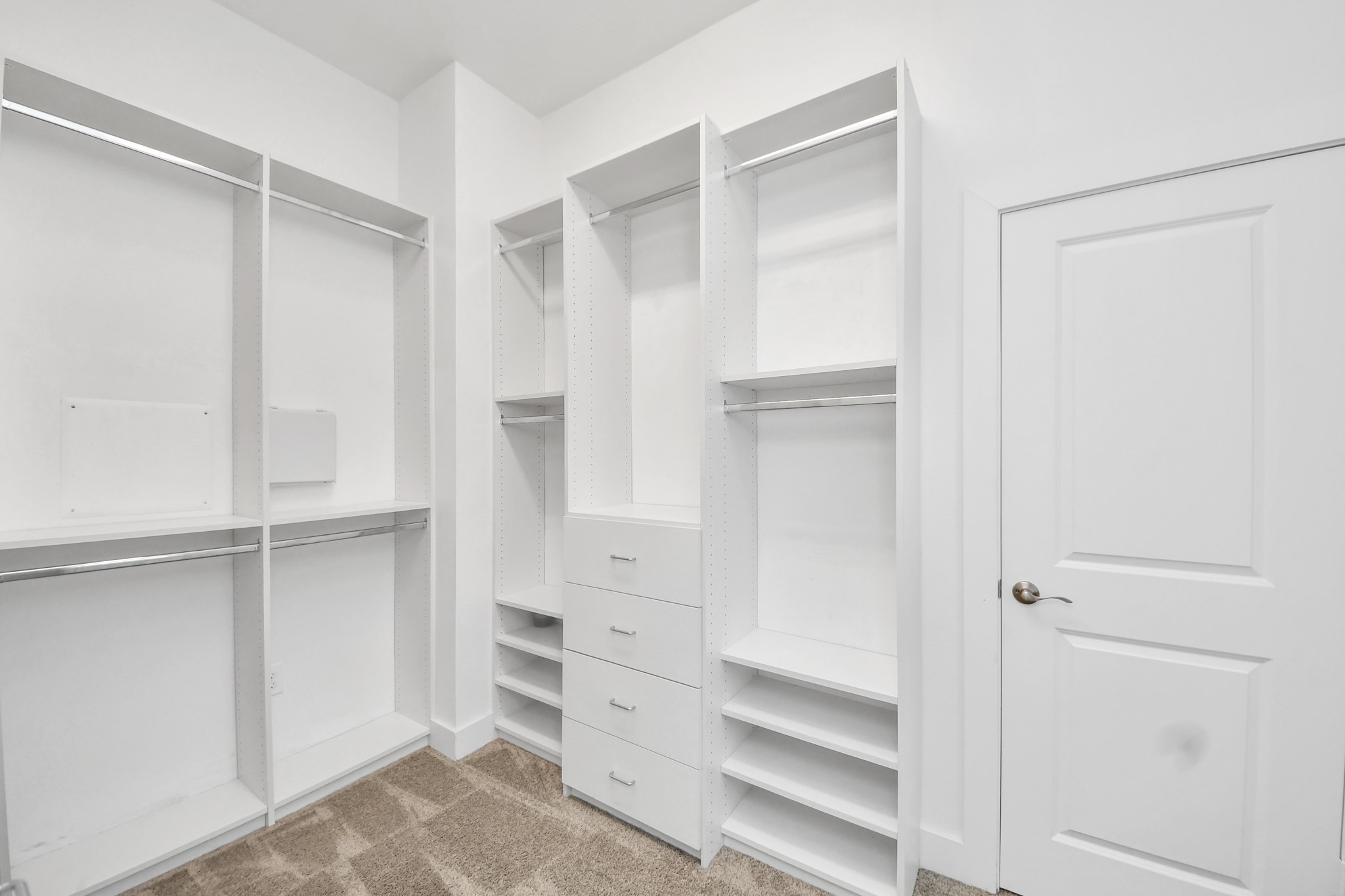 2704 Freund Street Houston, TX 77003 - Photo 31 of 45 a view of walk in closet with empty racks