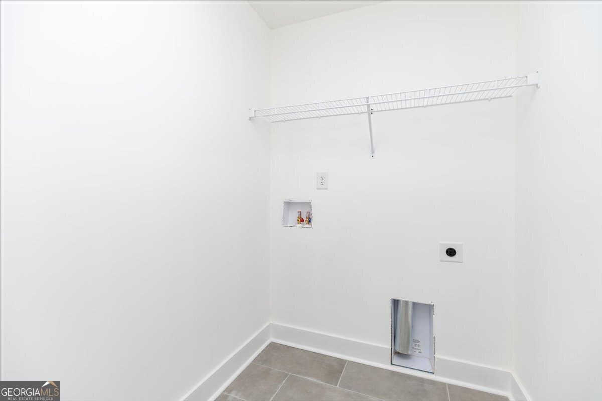 506 New Hope Drive Perry, GA 31069 - Photo 24 of 51 a view of small space with racks on the wall