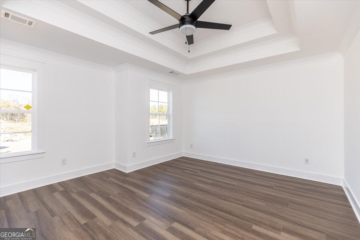 506 New Hope Drive Perry, GA 31069 - Photo 25 of 51 wooden floor in an empty room with a window