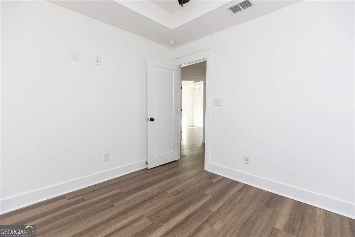 506 New Hope Drive Perry, GA 31069 - Photo 37 of 51 a view of an empty room with wooden floor and closet