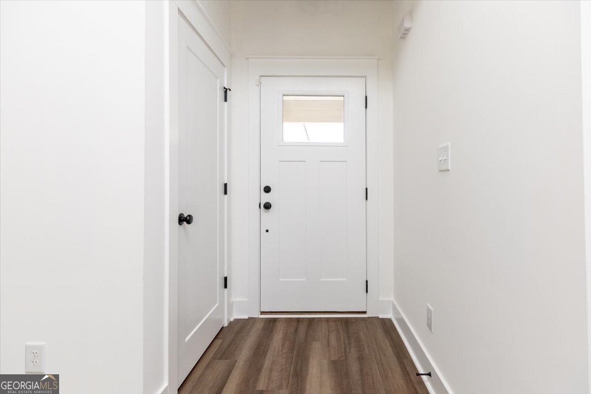 506 New Hope Drive Perry, GA 31069 - Photo 4 of 51 a view of a hallway with wooden floor