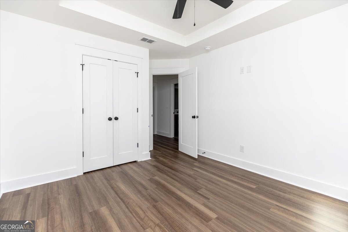 506 New Hope Drive Perry, GA 31069 - Photo 42 of 51 a view of an empty room with wooden floor
