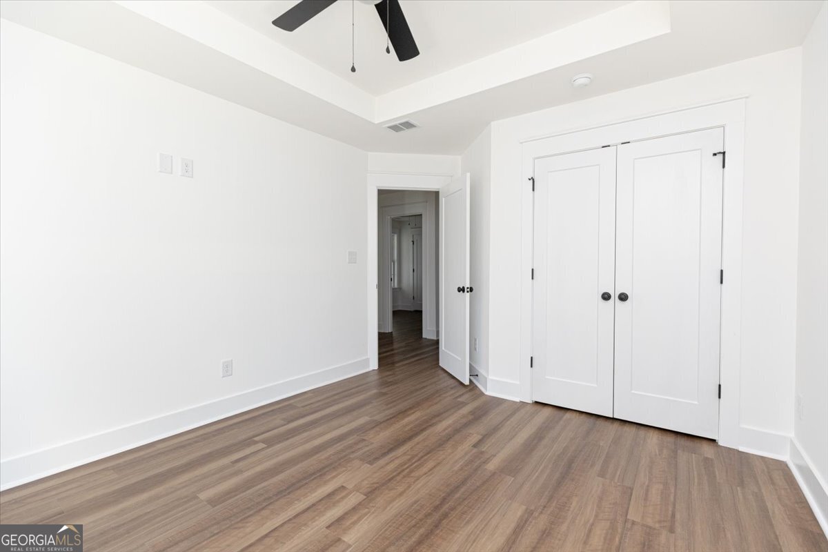 506 New Hope Drive Perry, GA 31069 - Photo 45 of 51 a view of an empty room with wooden floor