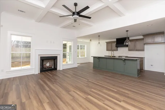 a view of kitchen with cabinets and wooden floor