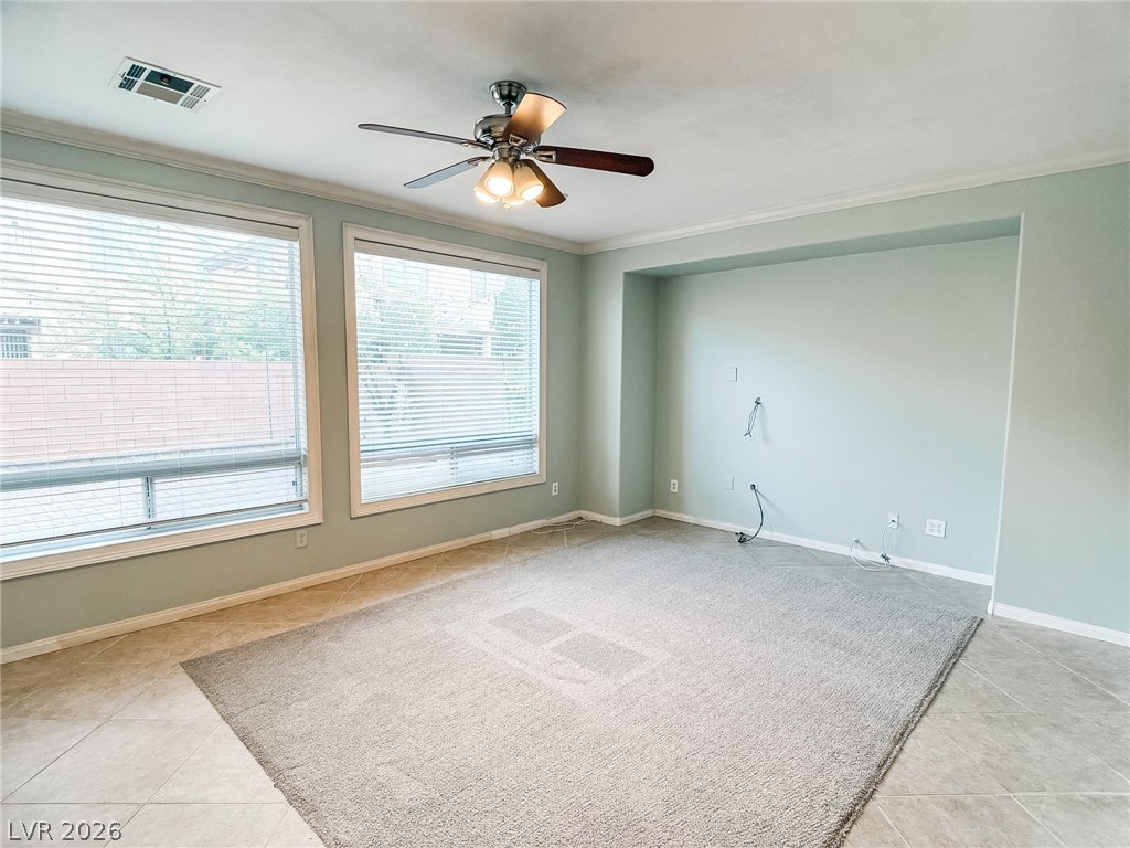 8683 Moreno Mountain Avenue Las Vegas, NV 89178 - Photo 3 of 26 A spacious room offers ample natural light and a ready-to-customize media wall.