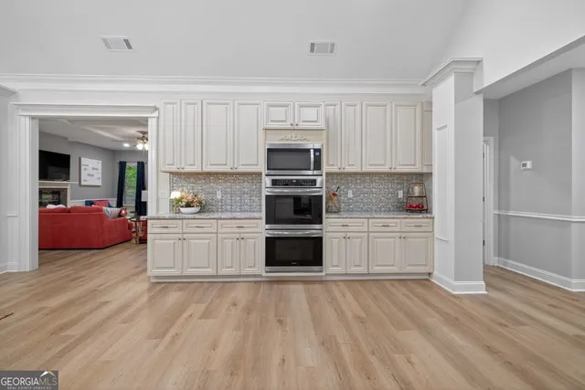 a bedroom with a bed and a ceiling fan