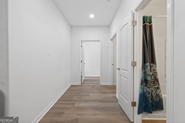 a aerial view of a house with a yard table and chairs
