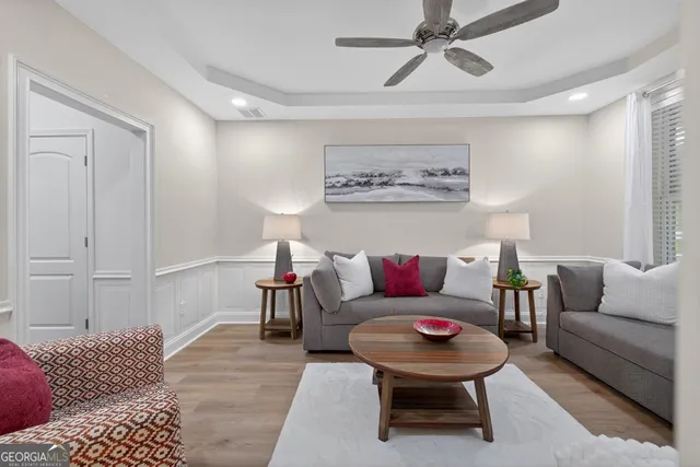 a large kitchen with kitchen island a sink table and chairs