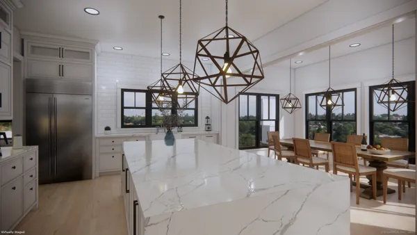 a view of a living room and chandelier fan