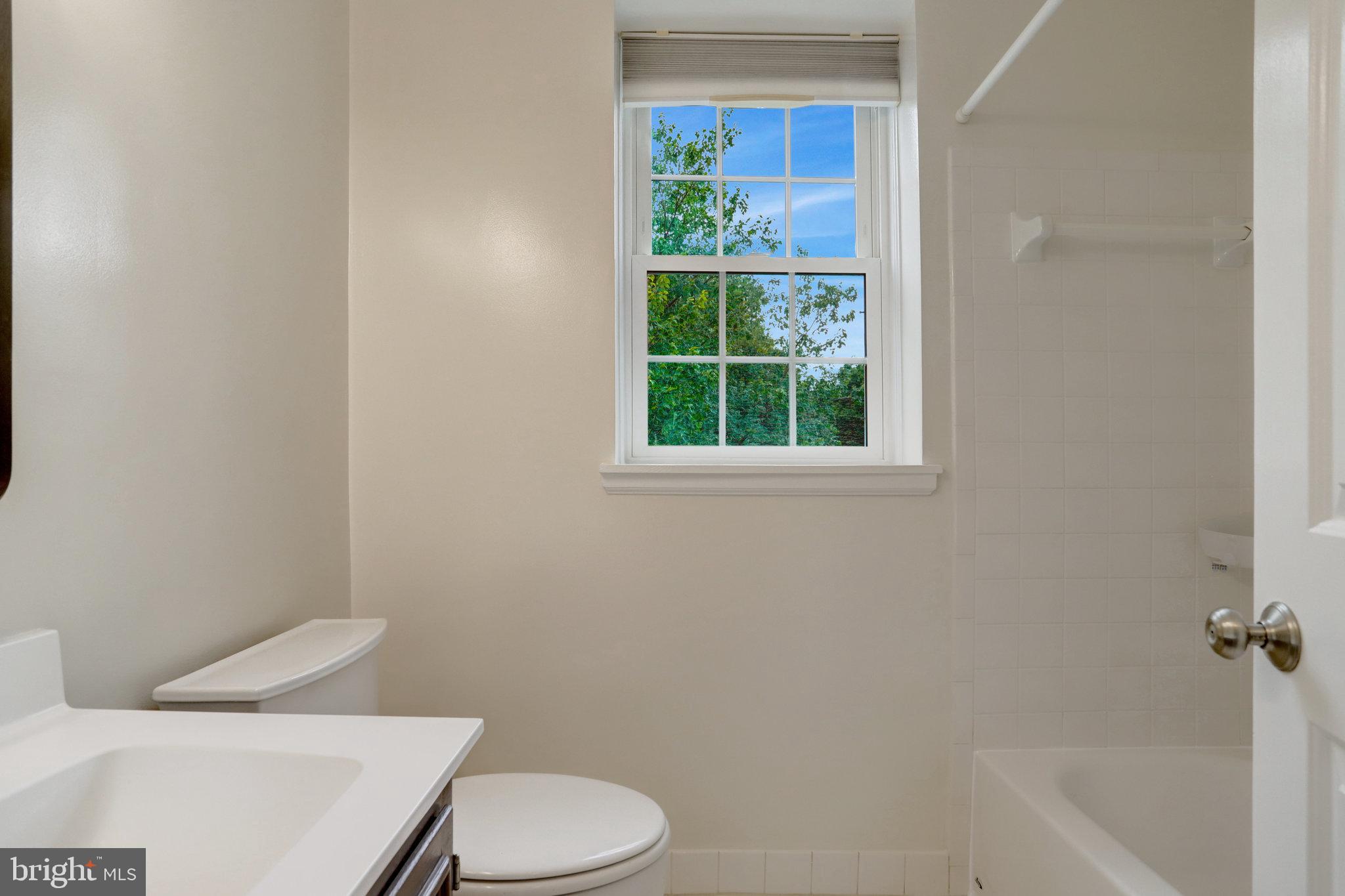 3062 South Buchanan Street, Unit C2 Arlington, VA 22206 - Photo 17 of 33 a white toilet sitting next to a bath tub
