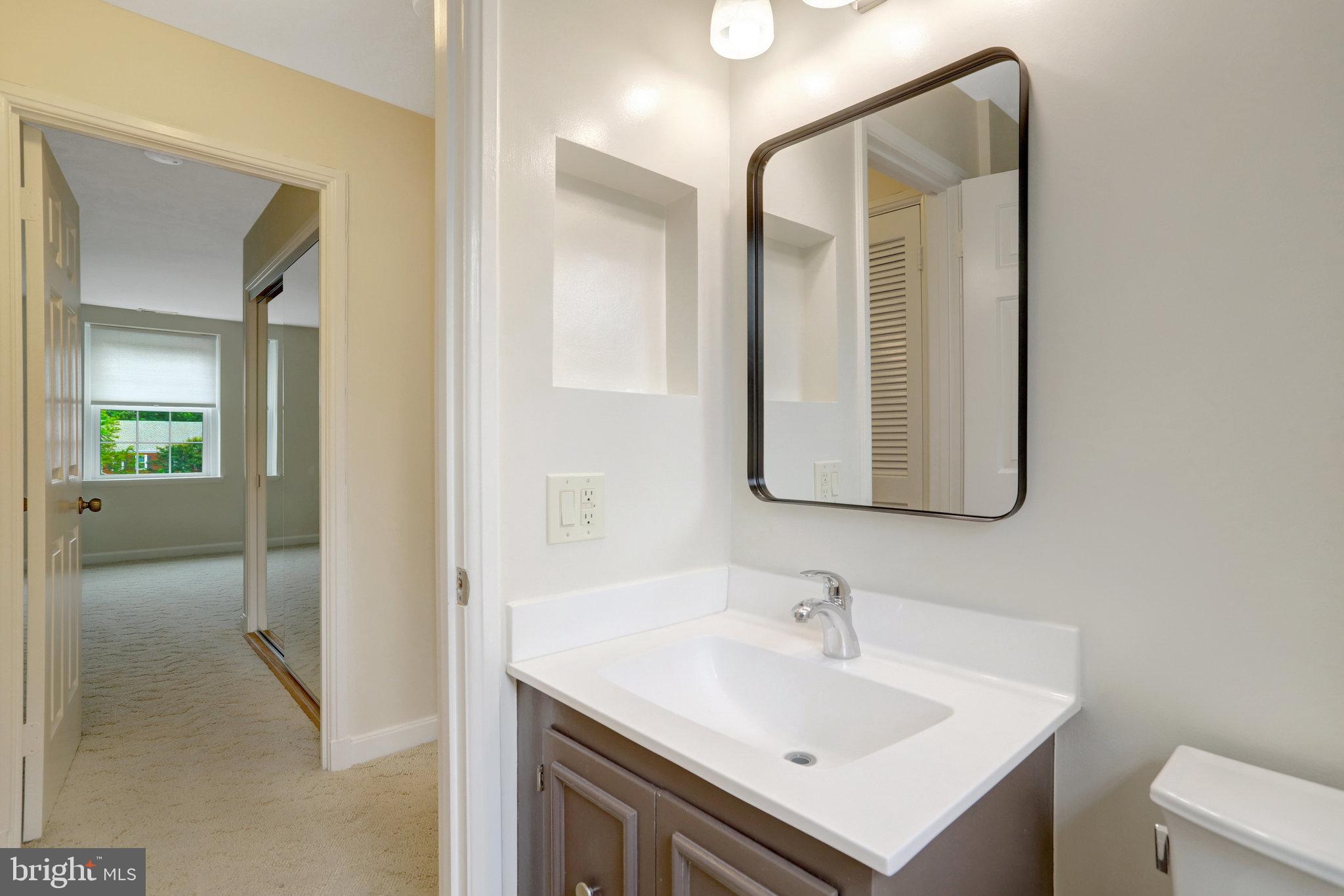 3062 South Buchanan Street, Unit C2 Arlington, VA 22206 - Photo 19 of 33 a bathroom with a sink and a mirror
