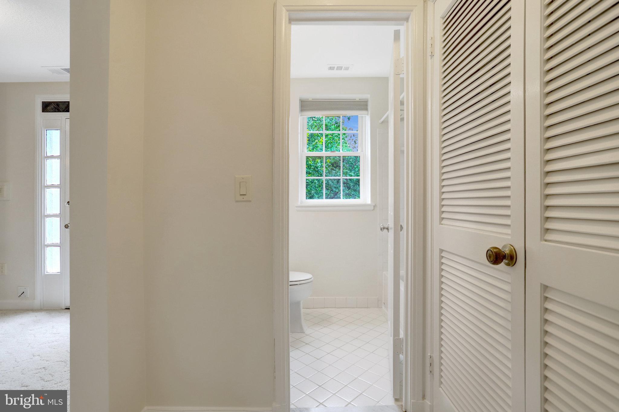 3062 South Buchanan Street, Unit C2 Arlington, VA 22206 - Photo 21 of 33 a view of a bathroom from a corridor