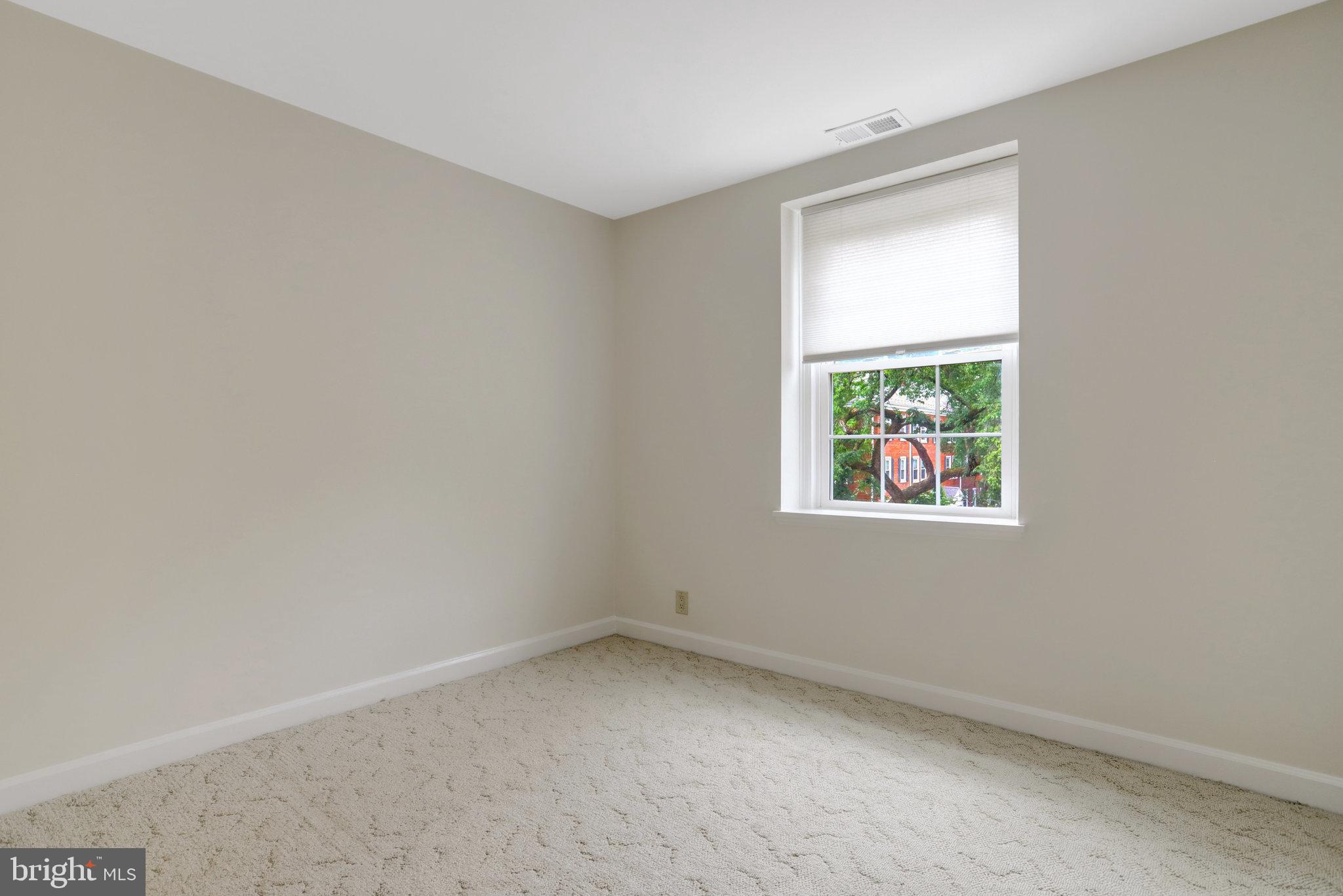 3062 South Buchanan Street, Unit C2 Arlington, VA 22206 - Photo 27 of 33 an empty room with windows