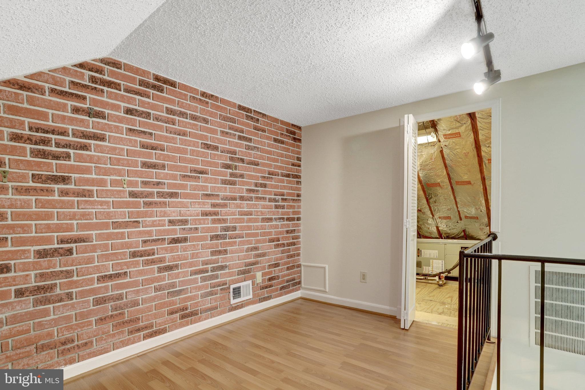 3062 South Buchanan Street, Unit C2 Arlington, VA 22206 - Photo 31 of 33 a view of an empty room and wooden floor