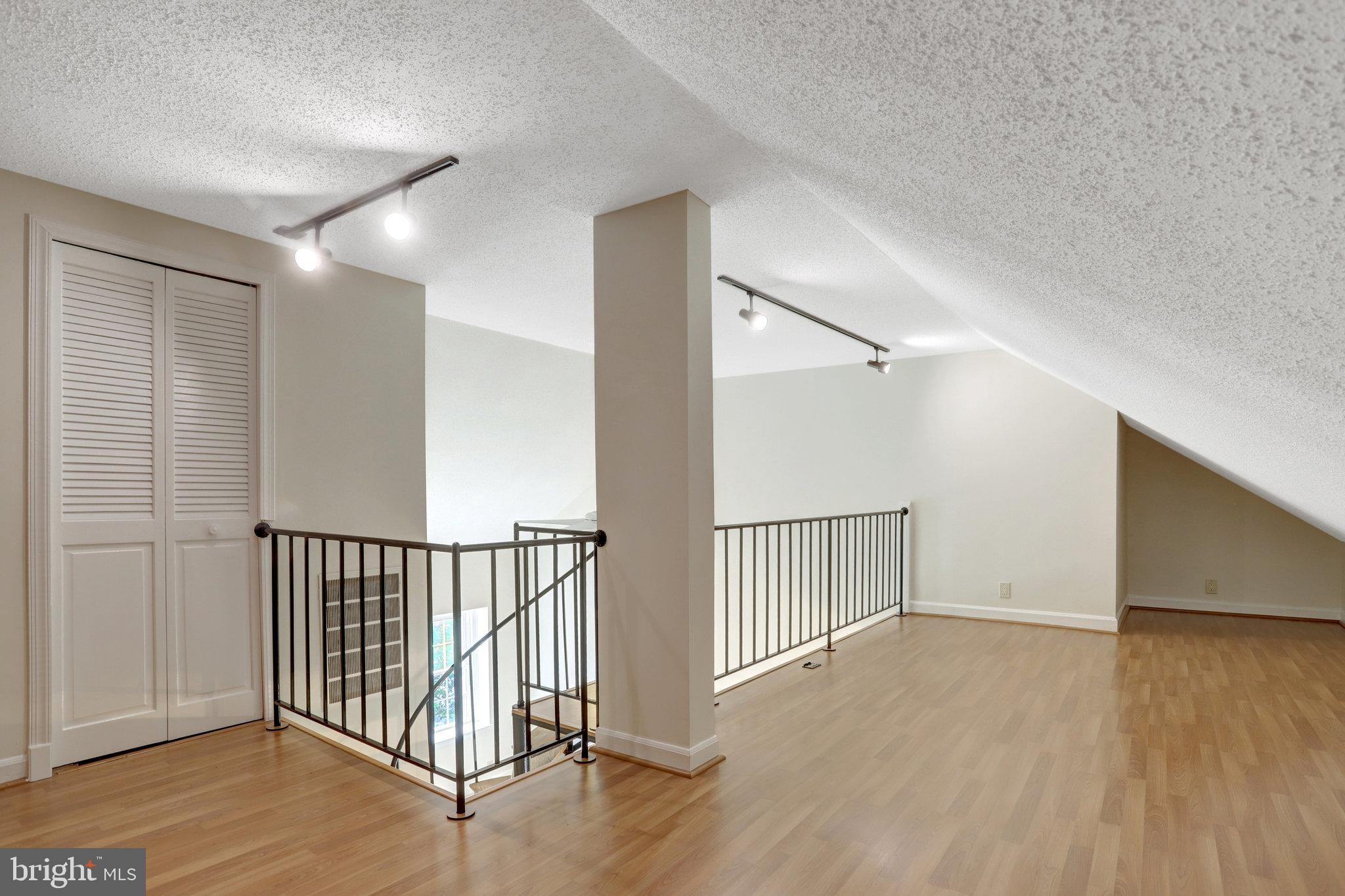 3062 South Buchanan Street, Unit C2 Arlington, VA 22206 - Photo 32 of 33 a view of hallway with wooden floor