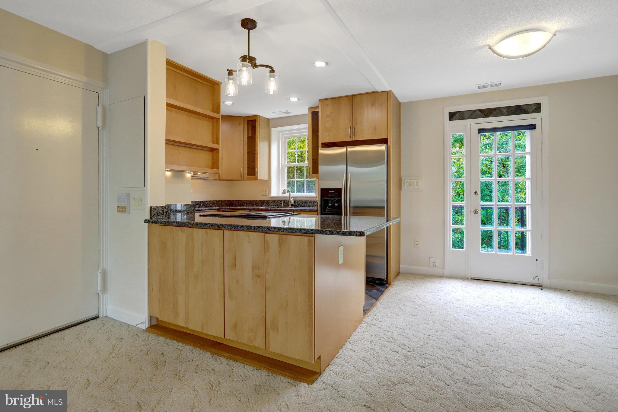 3062 South Buchanan Street, Unit C2 Arlington, VA 22206 - Photo 7 of 33 a kitchen with stainless steel appliances a refrigerator and a stove top oven