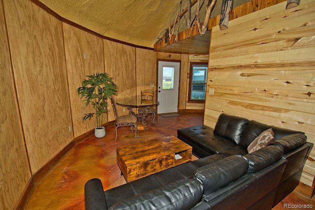 426 Shakedown Street Moffat, CO 81143 - Photo 11 of 17 a living room with furniture