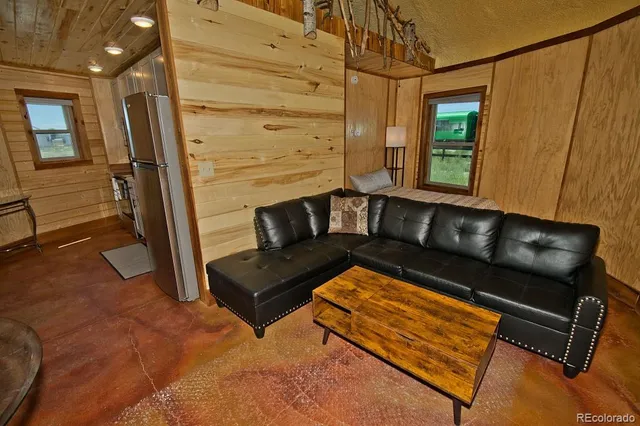 a view of a living room with furniture