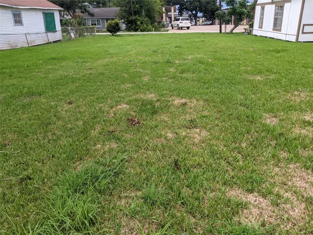 a view of a house with a yard porch and sitting area