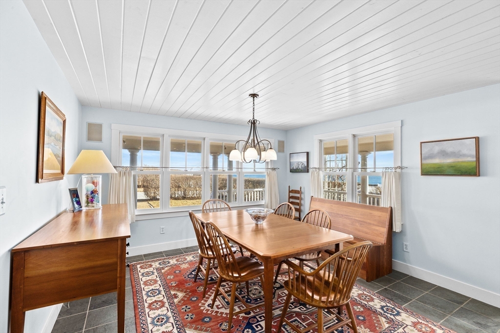 18 Collier Road Scituate, MA 02066 - Photo 11 of 40 a dining room with furniture a chandelier and wooden floor