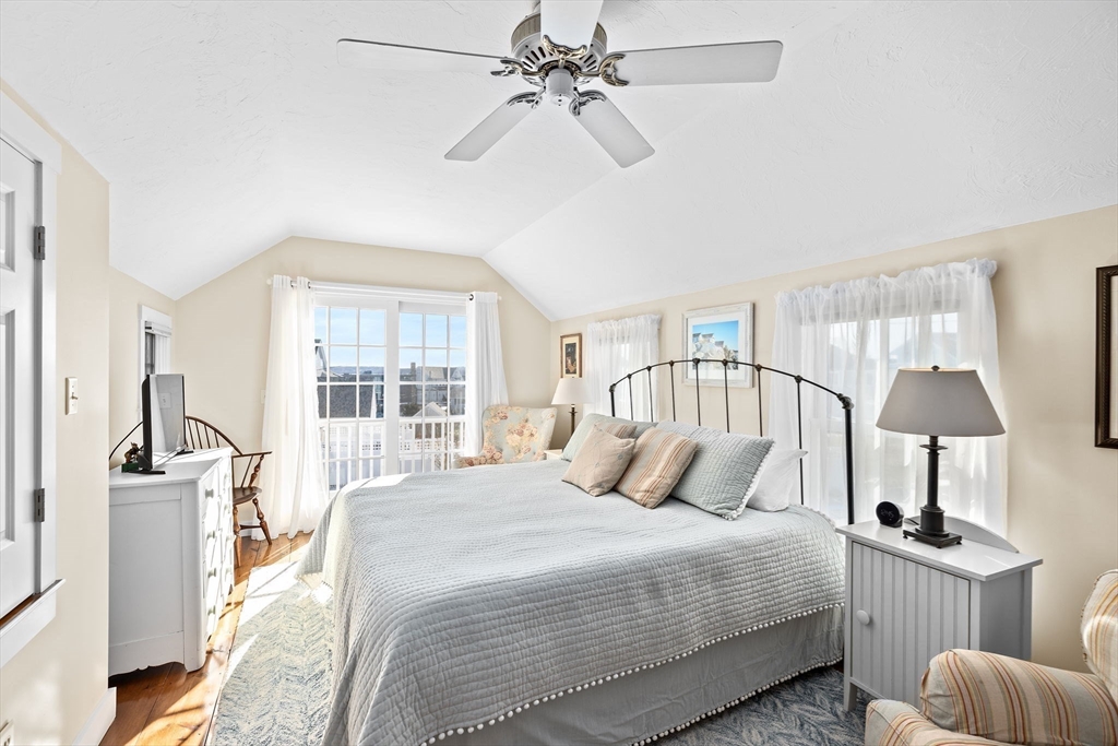 18 Collier Road Scituate, MA 02066 - Photo 17 of 40 a bedroom with a bed and a large window with the outer view