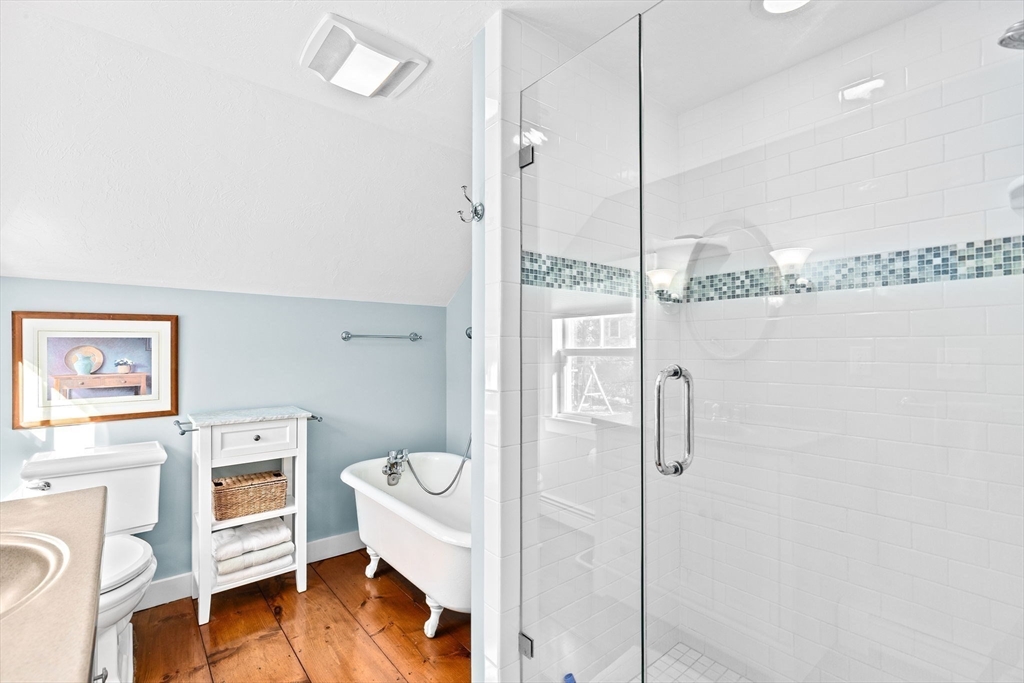 18 Collier Road Scituate, MA 02066 - Photo 18 of 40 a view of a bathroom with a toilet a sink and a mirror