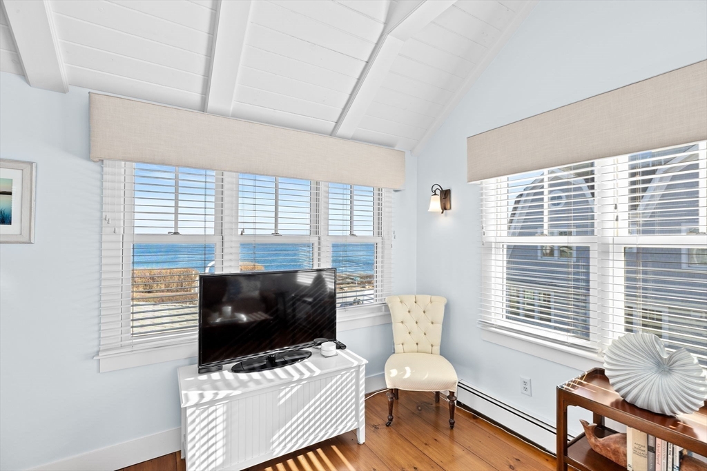 18 Collier Road Scituate, MA 02066 - Photo 27 of 40 a living room with furniture and a flat screen tv