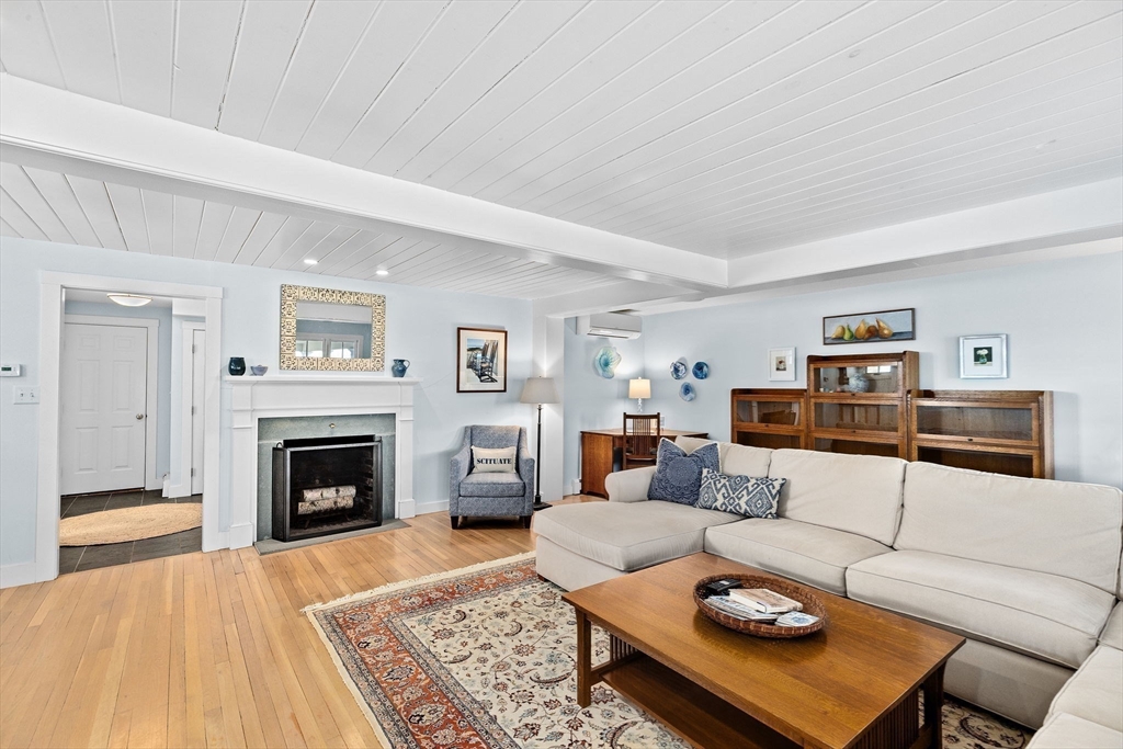 18 Collier Road Scituate, MA 02066 - Photo 5 of 40 a living room with furniture and a fireplace
