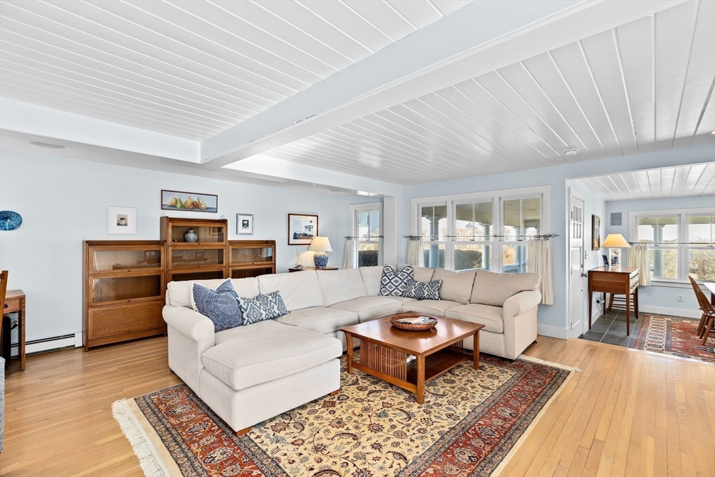 18 Collier Road Scituate, MA 02066 - Photo 6 of 40 a living room with furniture and wooden floor