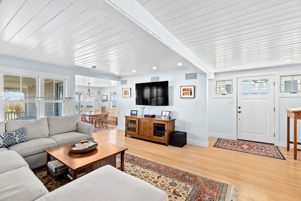 18 Collier Road Scituate, MA 02066 - Photo 7 of 40 a living room with furniture and a flat screen tv