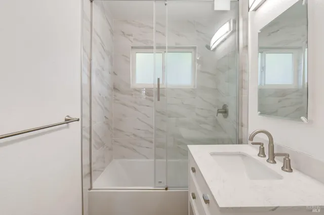 a bathroom with a bathtub and a sink