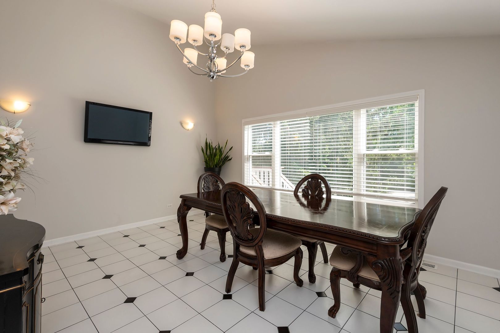 340 3rd Street Wheeling, IL 60090 - Photo 16 of 38 a view of a dining room with furniture and chandelier
