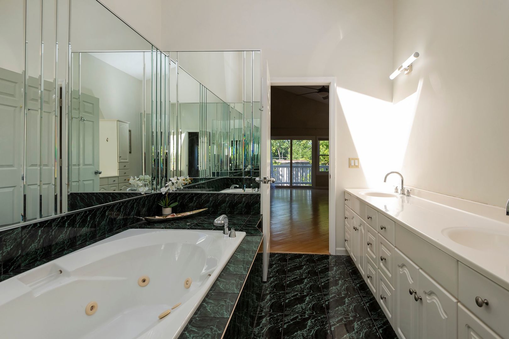340 3rd Street Wheeling, IL 60090 - Photo 35 of 38 a bathroom with a double vanity sink and mirror with bathtub