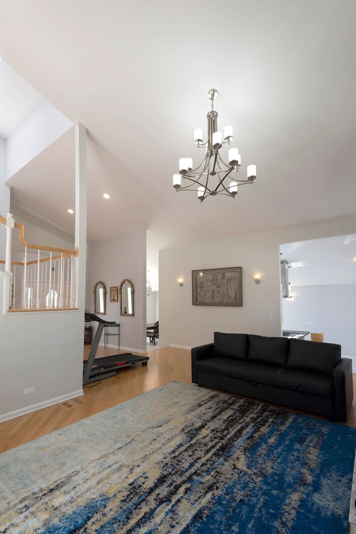 340 3rd Street Wheeling, IL 60090 - Photo 10 of 38 a living room with a couch and chandelier