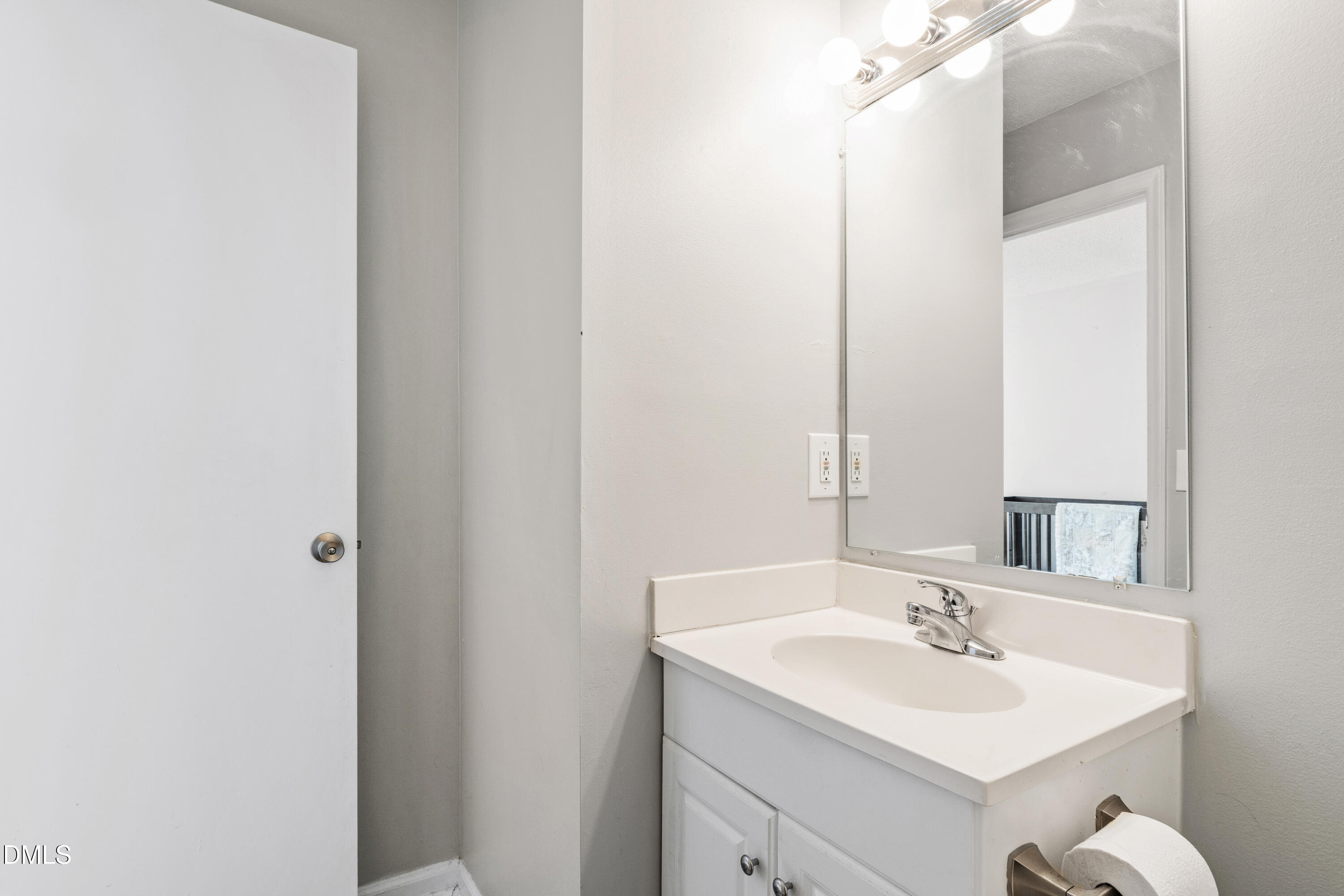 705 Felicia Street Durham, NC 27704 - Photo 17 of 37 a bathroom with a sink and a mirror