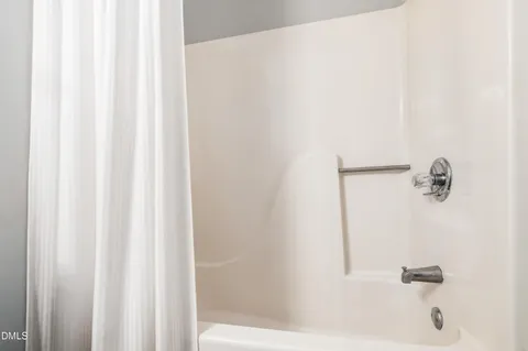 a bathroom with a shower curtain
