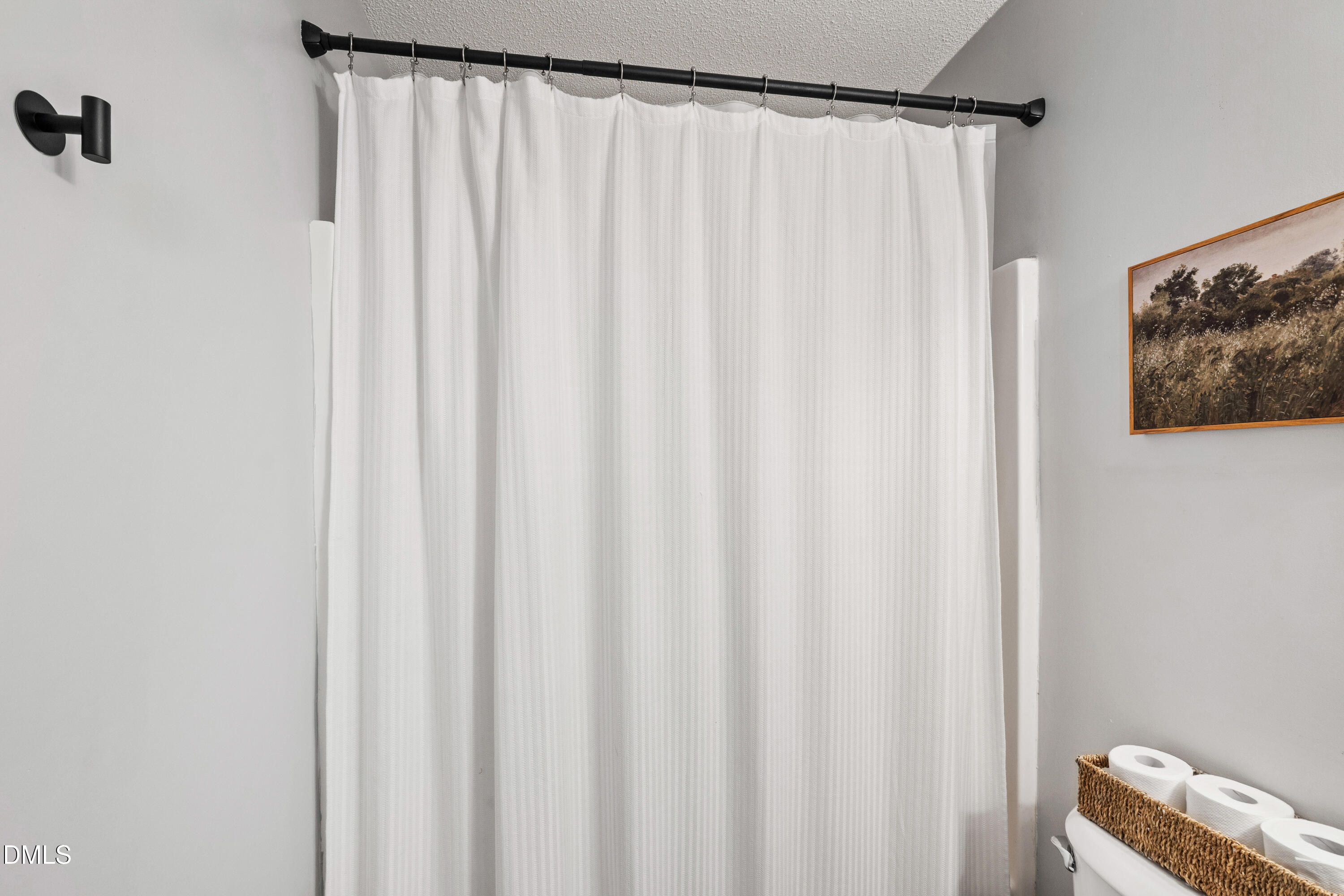 705 Felicia Street Durham, NC 27704 - Photo 20 of 37 a bathroom with a shower curtain and a curtain